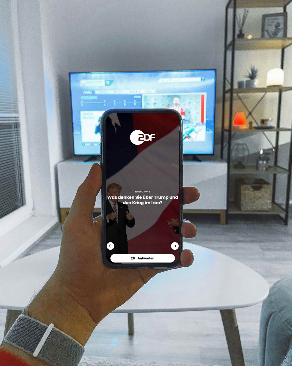 Viewer interacting with ZDF broadcast using HappyClient on smartphone